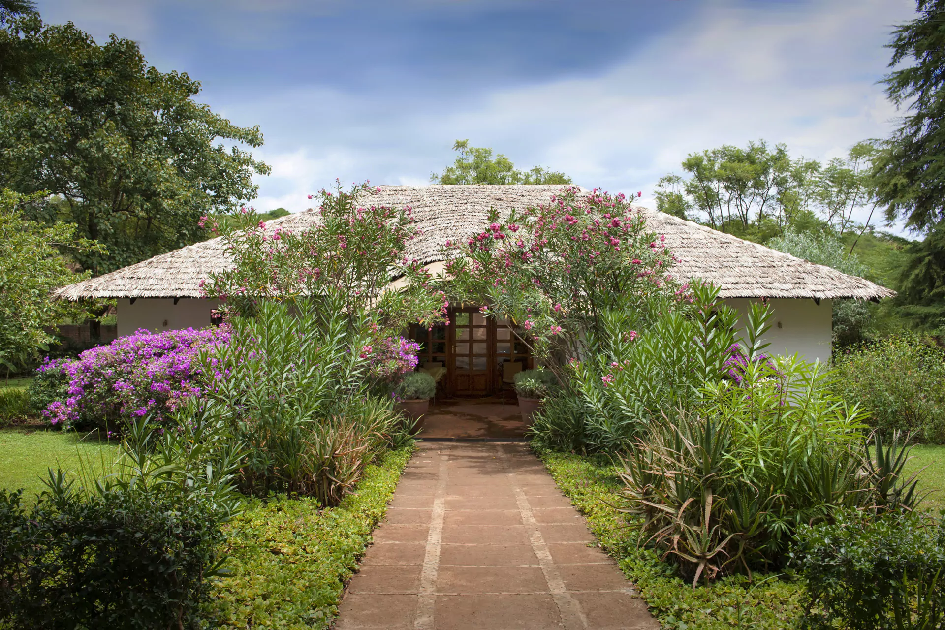 Tansania Safari Karatu The Plantation Lodge Kleines Haus Garten